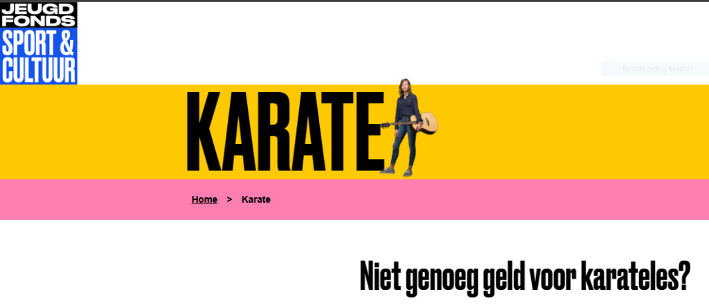 Jong kind oefent karate‑techniek op dojo‑vloer, ondersteund door Jeugdfonds Sport & Cultuur zodat iedereen kan mee­doen met karateles